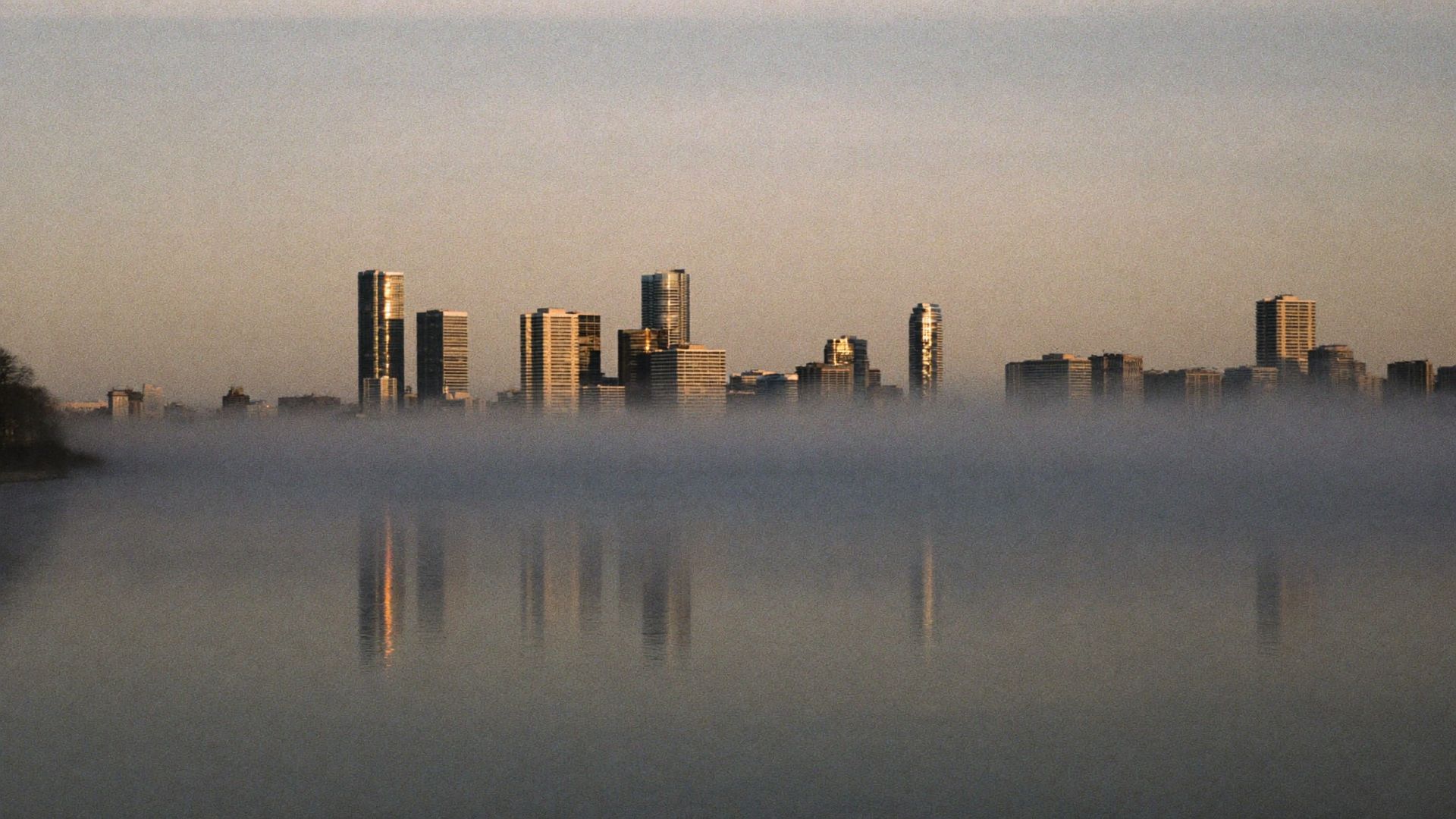 Canadian lakefront city skyline at dawn